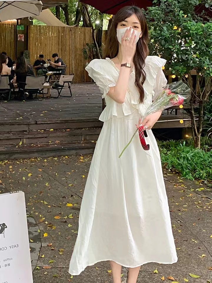 法式仙女杏色初戀溫柔風別致茶歇中長裙夏季短袖顯瘦修身氣質裙子