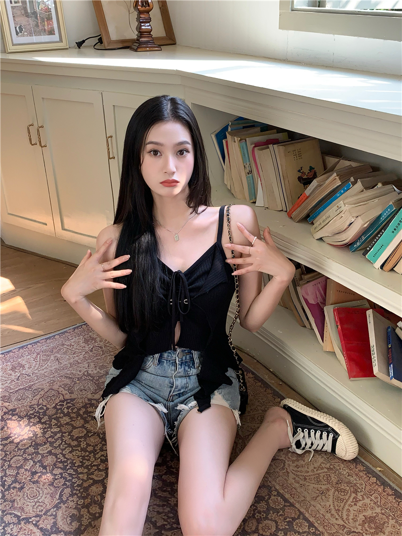 Actual shot of chic and irregularly designed halterneck sleeveless knitted camisole top for women