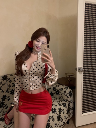 Real shot of retro polka-dot satin shirt + red skirt