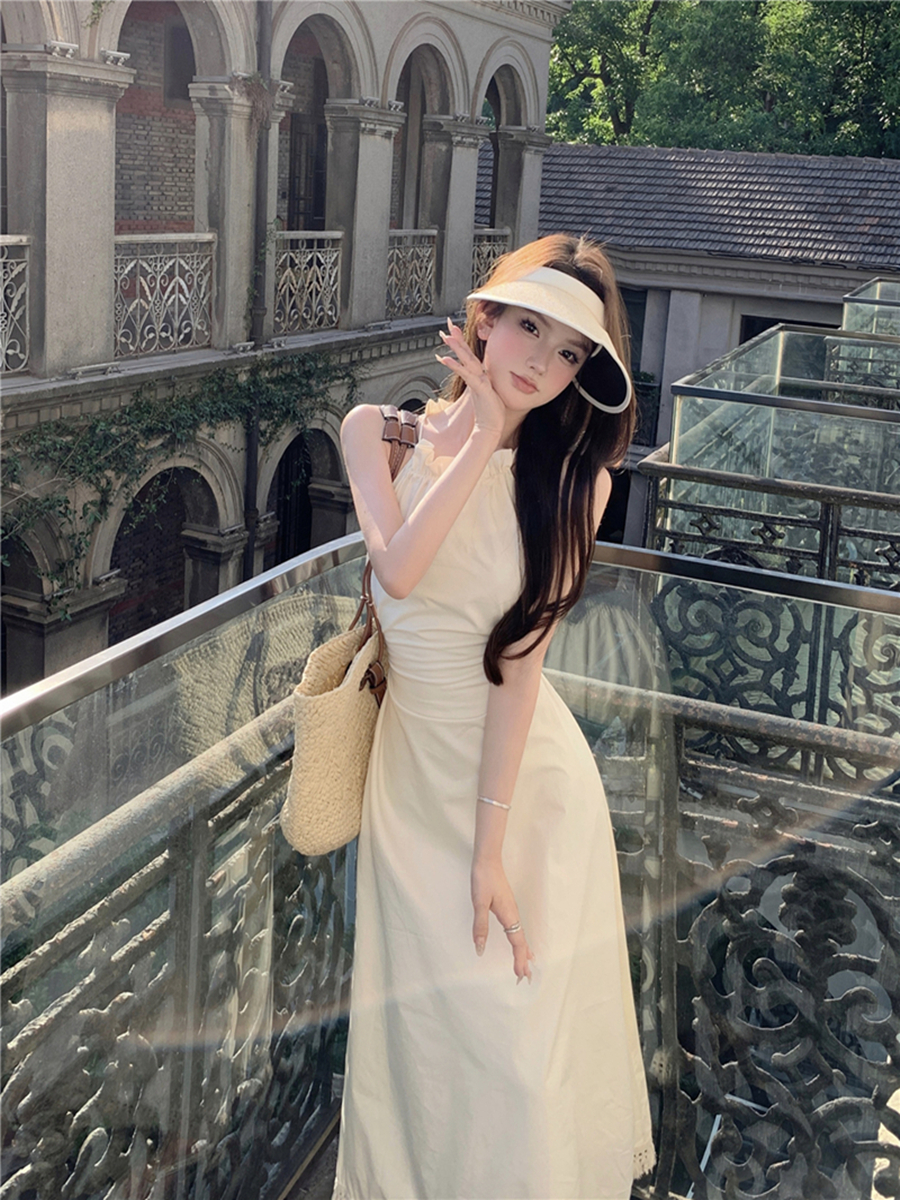 實拍性感鏤空露腰掛脖吊帶連衣裙女系帶收腰顯瘦流蘇花邊長裙
