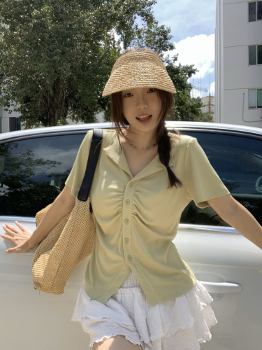 Real shot of pleated polo collar top with slimming short sleeves