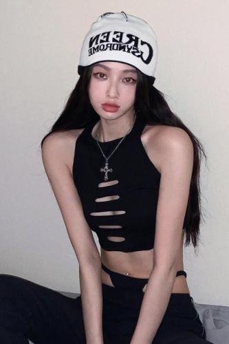 Real shot of Millennial hottie with hollow holes and sexy black vest showing navel pure lust style suspender top for women