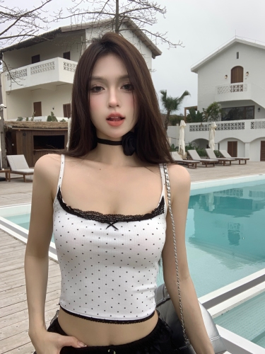 Real shot of an American hottie with a polka-dot cherry lace suspender that can be worn inside or outside with a vest top