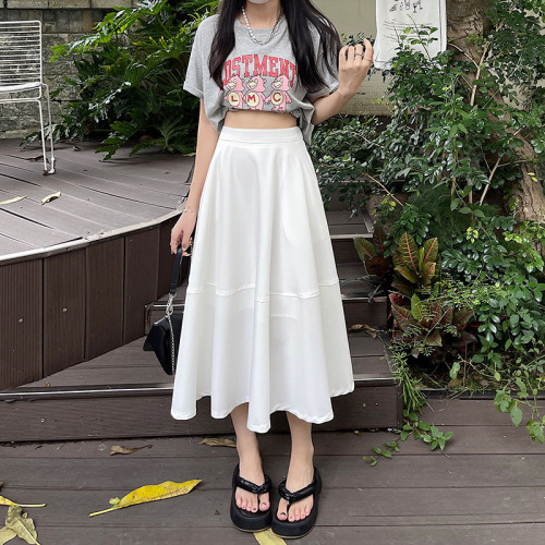 Actual shot of white skirt for women with high waist and drapey A-line mid-length skirt with elastic waist at the back and big strike skirt and umbrella skirt.