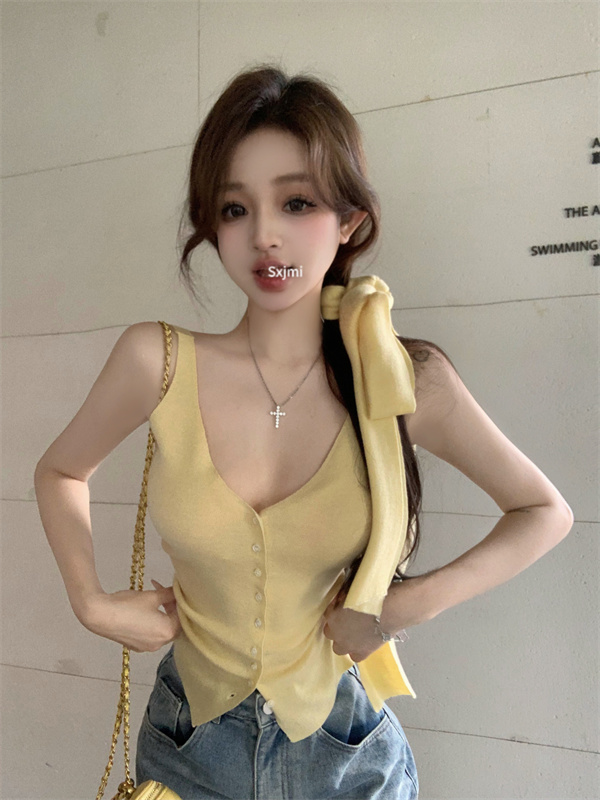 Actual shot of minimalist thin scarf, shell buckle, slimming knitted vest and suspenders