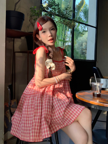 Real shot of Korean chic Xia's age-reducing person wearing a red plaid suspender dress