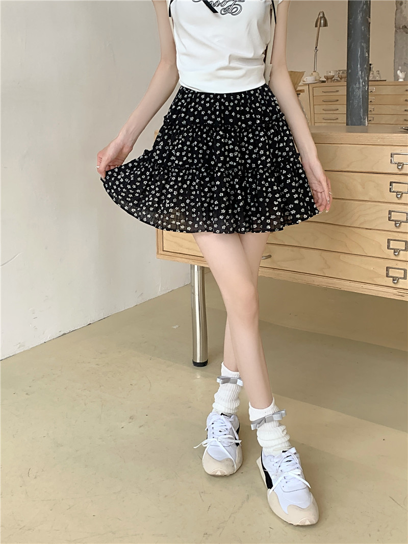 Photographed in 2024, this high-waisted, versatile, slimming, sweet cake short skirt features a relaxed fit and floral pattern with a drawstring waistband for women.