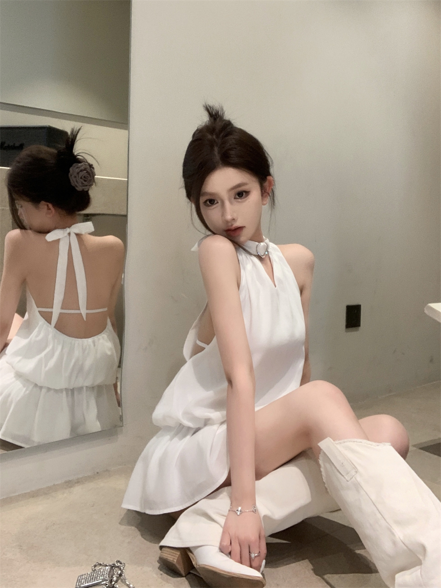 Actual shot of halterneck, hollow, airy little black dress, backless and shoulderless dress
