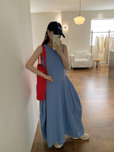 Real shot of a simple, elegant, high-waisted long dress with pockets