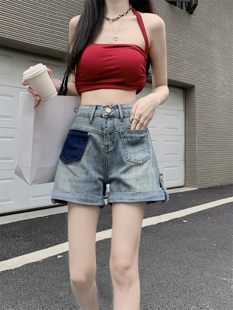 實拍新款設計感卷邊牛仔短褲女夏季顯瘦百搭時髦拼接高腰潮流短褲