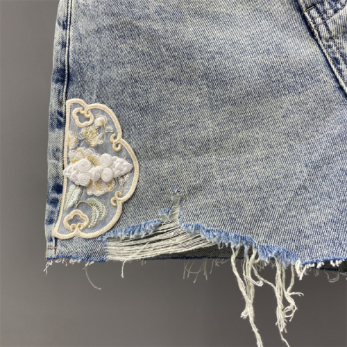 Niche design Chinese style embroidered disc buckle ripped raw edge denim shorts for women spring and summer wide leg A-line hot pants trendy