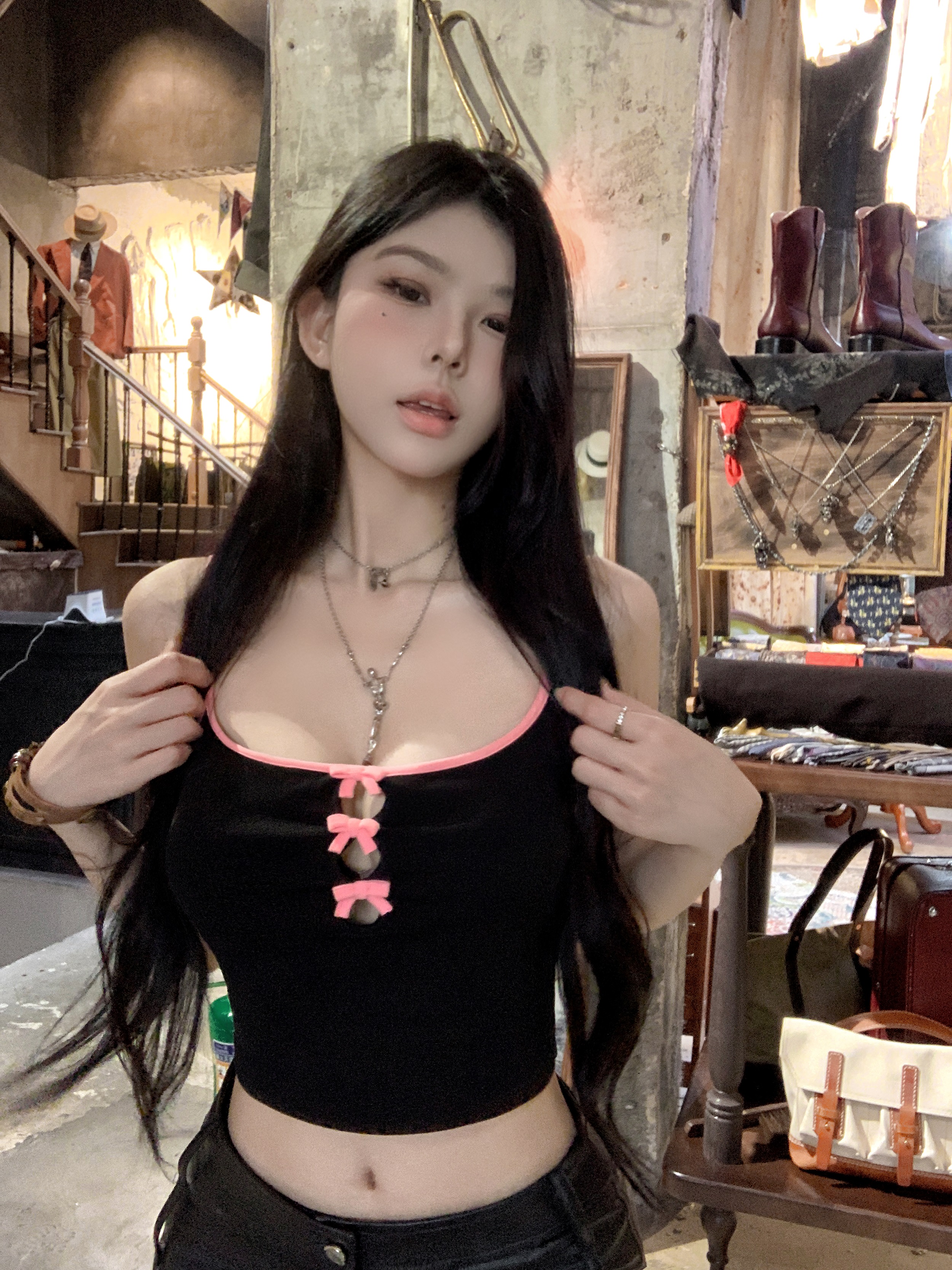 Actual shot of hot girl with hollow bow wearing camisole, summer short inner top for women