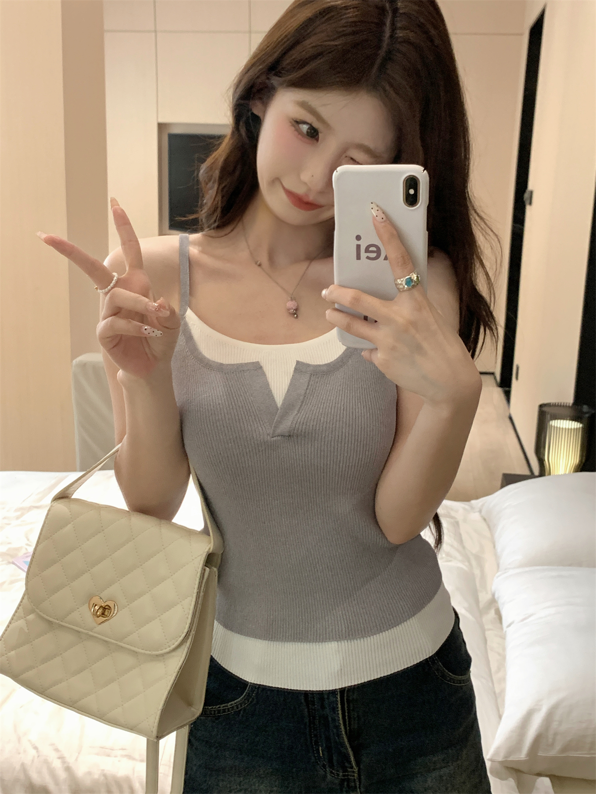 Actual shot of summer Korean style slim-fit pure lust half-open collar contrasting fake two-piece suspender knitted vest top for women