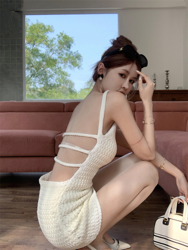 Real shot of a sexy backless hot girl wearing a sexy white suspender dress