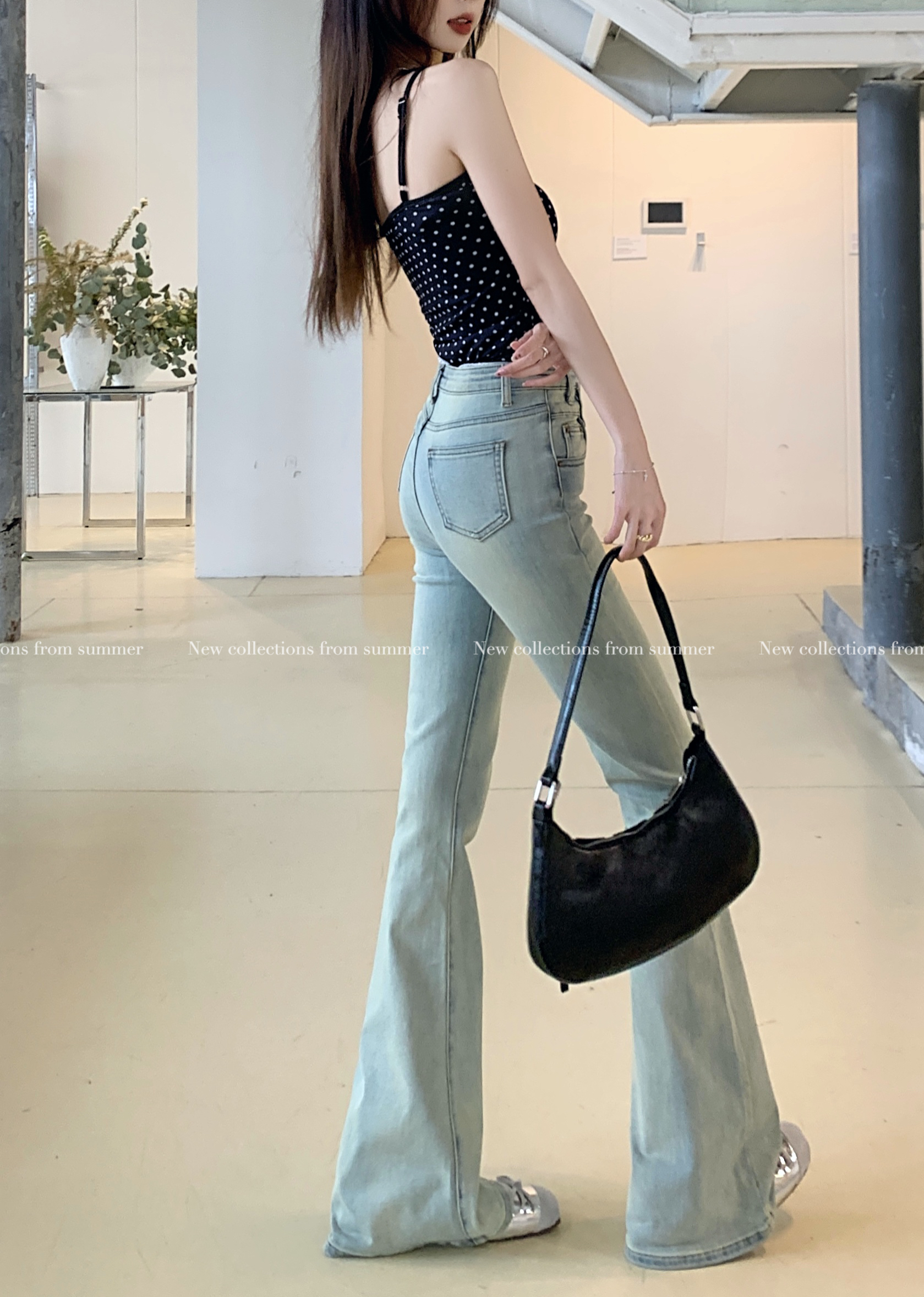 Actual shot of high-waisted stretchy versatile bootcut jeans