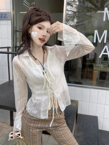 Real shot of hot girl style slightly see-through hollow knitted cardigan with bell sleeves and sun protection short shirt top