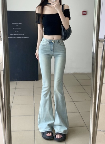 Real shot of high-waisted hottie washed blue stretchy bootcut jeans