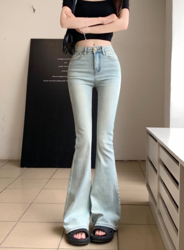 Real shot of high-waisted hottie washed blue stretchy bootcut jeans