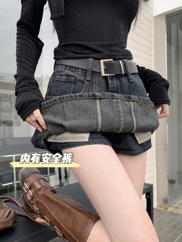 Real shot of hot girl in retro high-waisted denim skirt and pants to prevent exposure