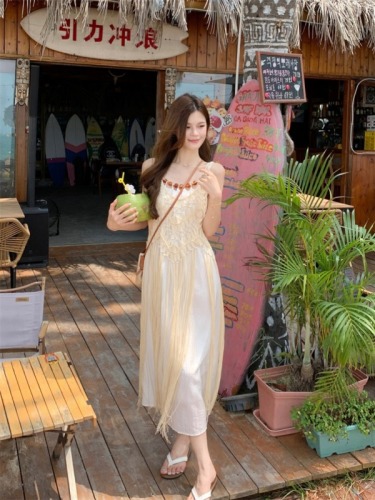 Real shot of seaside resort style hollow braided fringed vest blouse layered with suspender dress two-piece set