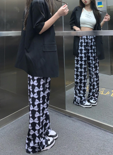 Actual shot of high-waist casual pants, loose printed drapey straight wide-leg pants