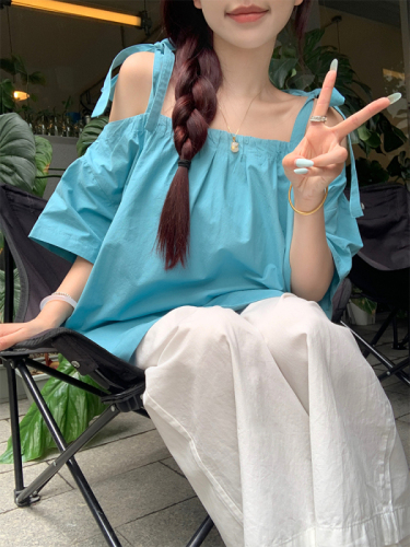 Real shot of Korean chic Xia wearing a lake blue discreet one-shoulder shirt top