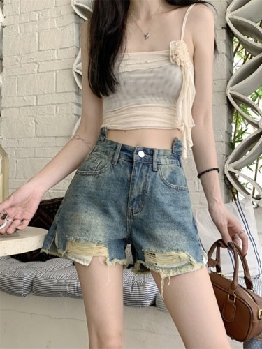 Real shot of hot girl design niche high-waist slim denim shorts with holes and raw edges for women