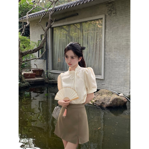 A modern Chinese style national costume top with a unique design, targeted at a niche market, featuring a high-end, French retro short-sleeve blouse for summer.