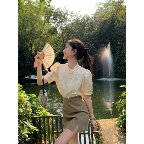 A modern Chinese style national costume top with a unique design, targeted at a niche market, featuring a high-end, French retro short-sleeve blouse for summer.