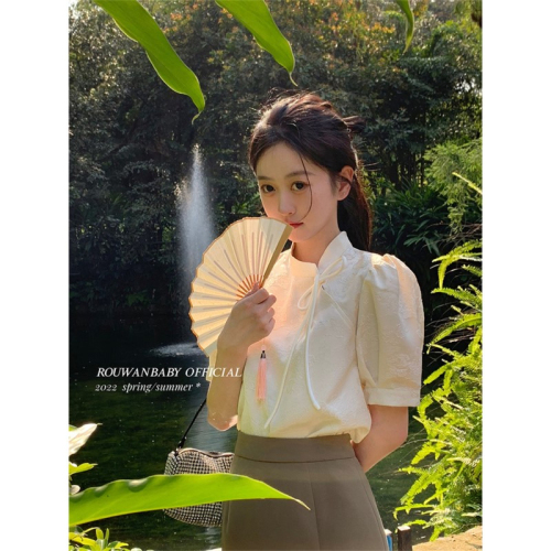 A modern Chinese style national costume top with a unique design, targeted at a niche market, featuring a high-end, French retro short-sleeve blouse for summer.