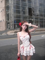 Photographed Bright Young Girl Floral Butterfly Bow Neckline Fishbone Bustier Straps + Lace Splicing Pom Pom Cupcake Skirt