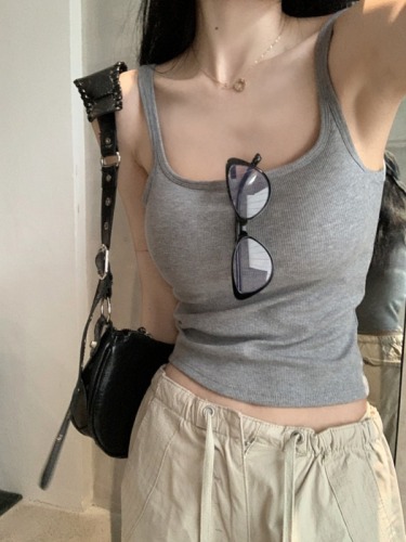 Actual shot of summer solid color slim fit and versatile short camisole top for women with breast pads
