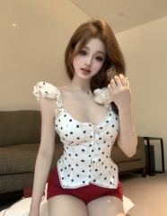 Real shot of women's patchwork lace top with small flying sleeves and polka dot print suspenders