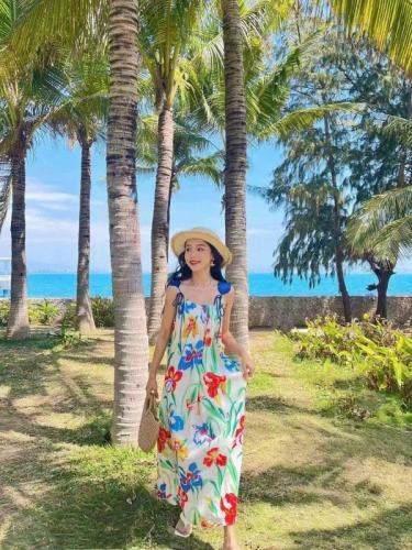 Sanya seaside resort beach dress Xishuangbanna travel long dress Yunnan Dali loose printed suspender dress