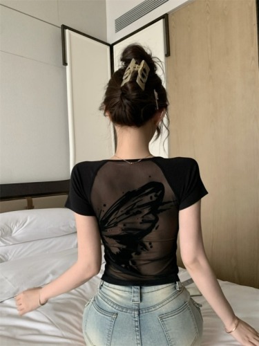 Real shot of hot girl with folded wings and butterfly in sexy mesh see-through back black short-sleeved tight top
