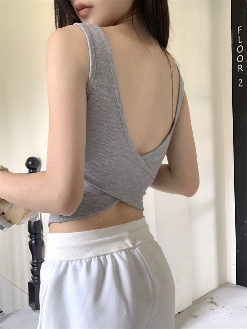 Actual shot of an all-in-one criss-cross bra with breast pads and a backless sexy slim-fitting top