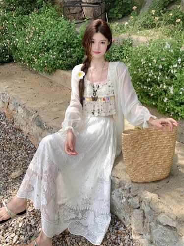 Real shot of French retro crocheted hollow suspender + long-sleeved sun protection cardigan + bohemian ethnic style skirt for women