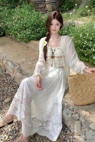 Real shot of French retro crocheted hollow suspender + long-sleeved sun protection cardigan + bohemian ethnic style skirt for women