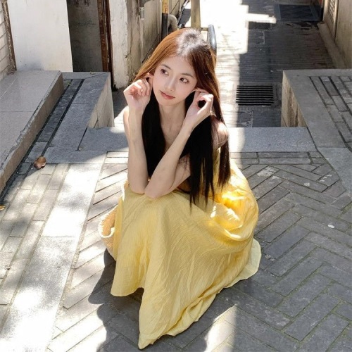 French 2024 summer new style halterneck suspender yellow dress gentle vacation high-end loose slimming long skirt