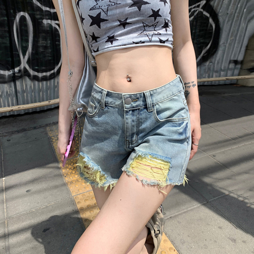 Real shot of summer light-colored ripped denim shorts for women with pear-shaped body, high waist, slimming, versatile A-line hot pants shorts