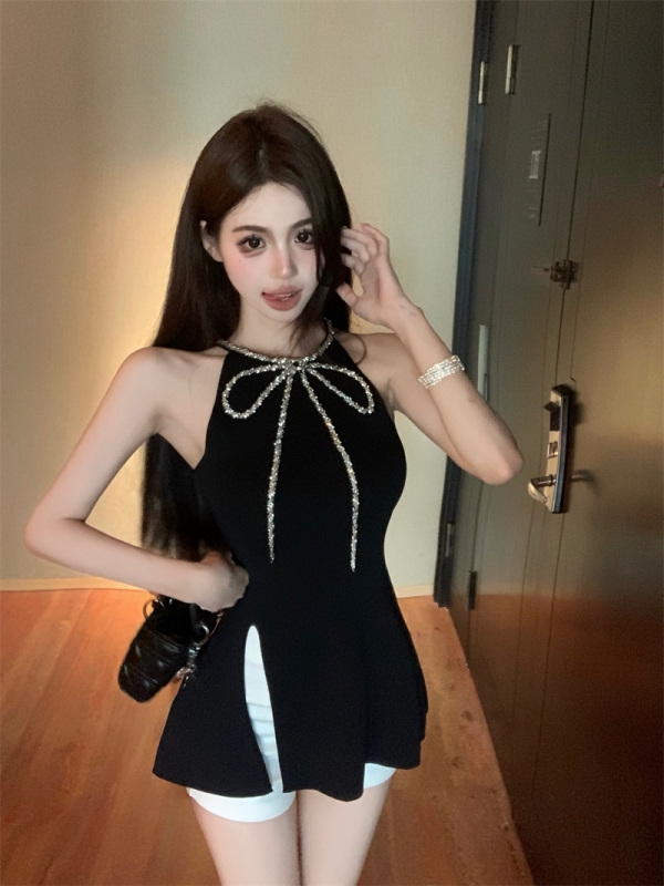 Actual shot of a pure lust hottie wearing a heavy-duty diamond-encrusted bow, elegant Hepburn suspender skirt, little black dress and short skirt
