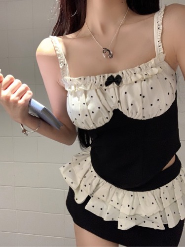 Actual shot of a pure and sweet hottie with bow-knot polka-dot splicing short suspender top + high-waisted pleated skirt for women