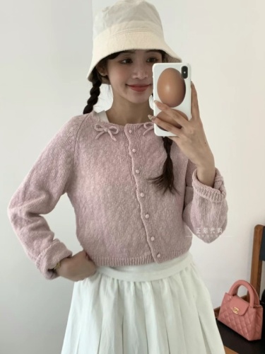 Now egg Korea Dongdaemun purchasing agent 2024 spring new fashion round neck oblique button bow knitted cardigan for women