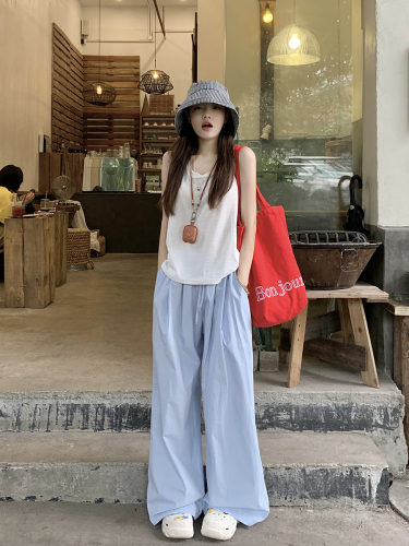 Actual shot of sleeveless top with straps on the back for women to wear outside + elastic waist and casual white wide-leg pants