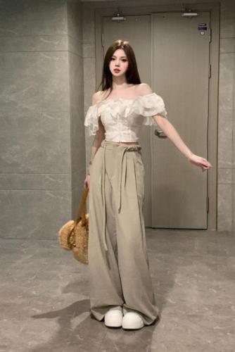 White lotus suit, ruffled one-shoulder short top, high-waisted drapey wide-leg floor-length pants