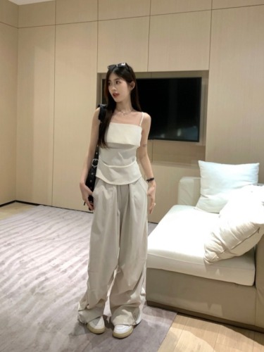 Actual shot of a two-piece set of designer waist-cinching top + loose casual drawstring overalls and trousers