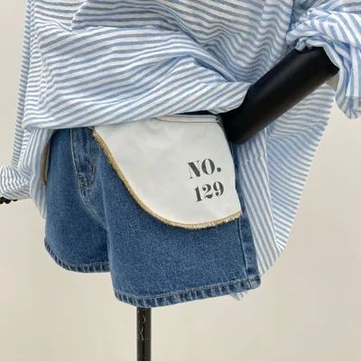 Versatile denim shorts with stylish letter design