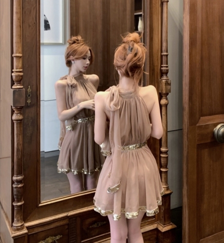 Actual shot of sunset glazed gold high-end gold sequin strappy halterneck skirt and waist dress