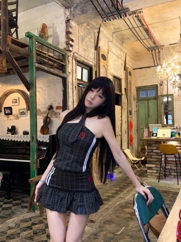 Actual shot of a pure lust hottie wearing a halterneck tie short vest + high-waisted A-line pleated miniskirt for women