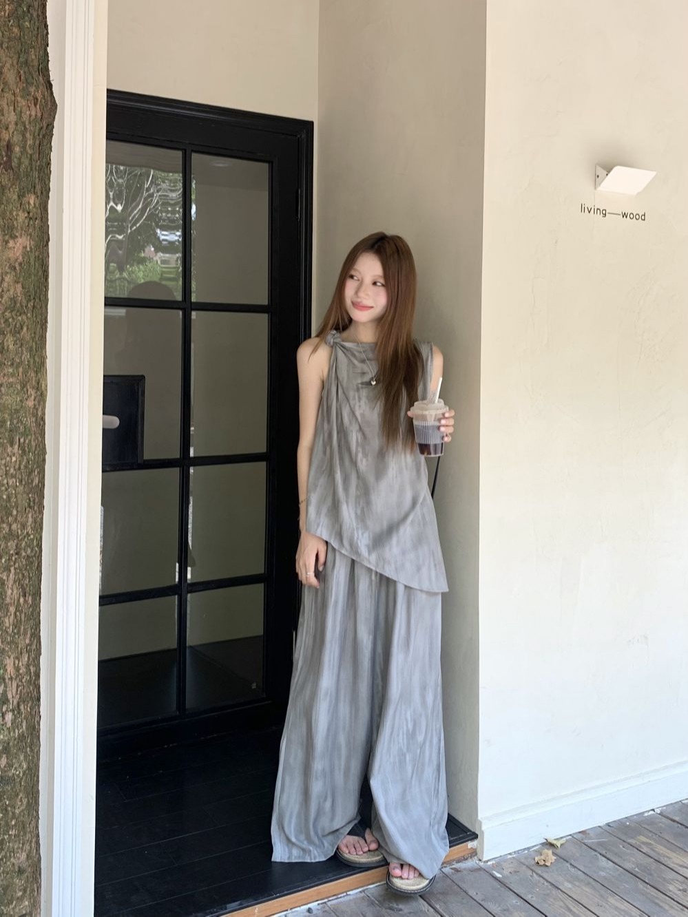 Actual shot of a new set of relaxed summer outfits, a two-piece set of new irregular sleeveless tops and wide-leg pants